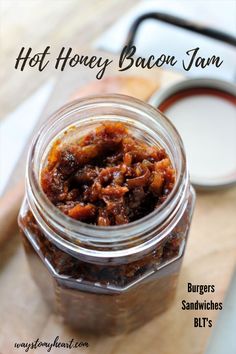 a jar filled with food sitting on top of a wooden table