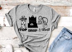 Stop Drop and Roll Hollywood Studios Unisex T-shirt with Stormtrooper, Tower of Terror, and Rock and Roller Rides Shown on Athletic Heather Grey Shirt Bella Canvas Unisex Tee 3001/3001CVC This updated unisex essential fits like a well-loved favorite, featuring a crew neck, and short sleeves, and designed with superior combed and ring-spun cotton Features: Side-seamed. Retail fit. Unisex sizing. Shoulder taping. The Regular(non-heather) are_100% Airlume combed and ring-spun cotton, 32 single 4.2 Hollywood Studios Shirts, Stop Drop And Roll, Rock N Roller Coaster, Disney Dress Up, Universal Shirts, Family Disney Trip, Disney Trip Shirts, Hollywood Studio, Disney Bound Outfits