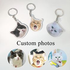 four different key chains with pictures of cats and kittens on them, all in the same photo