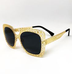 Flex in these exclusive Dani Joh gold and black sunglasses! These metal frame sunglasses are perfect for any season and are versatile enough to wear everyday. These sunglasses are made with metal hinges and 100% UV protected lenses. Enjoy these exclusive sunglasses and show us how you'll rock them by using the hashtag #ShopDaniJoh. Sunglasses Features: Black Sunglasses Metal Gold Frame Polarized lens 100% UV Protection One Size Modern Gold Cat Eye Sunglasses For Spring, Spring Party Sunglasses With Metal Frame, Gold Shield Sunglasses With Polarized Lenses For Beach, Gold Polarized Shield Sunglasses For Summer, Gold Polarized Shield Sunglasses For Beach, Gold Polarized Beach Sunglasses, Gold Polarized Sunglasses For Beach, Gold Modern Aviator Sunglasses For Beach, Spring Metal Sunglasses With Mirrored Lenses