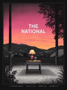 the national movie poster with a lamp on a table in front of mountains and trees