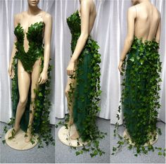 the mannequin is covered in green ivy