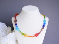 I make these rainbow necklaces with high-quality frosted glass that resembles ocean tumbled sea glass, but comes in fun vibrant colors that ocean tumbled sea glass never does. Please note that the shape and order of the beads may vary (depending availability), but the overall look will remain the same.  The rainbow beach glass necklace is light, but very sturdy. I make these necklaces for women to be 16"-24" - you can select your preference from the drop-down menu. You will also be able to choose the materials used: I offer sterling silver or silver plate. This statement rainbow necklace is finished with a toggle clasp. ----------------------------------------------------------------------------------------------- ♥ Matching bracelet: http://etsy.me/1wKMX8J  ♥ Earrings: http://etsy.me/1IL8 Multicolor Recycled Glass Jewelry For Gifts, Multicolor Recycled Glass Jewelry As A Gift, Adjustable Rainbow Glass Necklaces, Adjustable Rainbow Glass Necklace, Multicolor Recycled Glass Necklaces For Gifts, Multicolor Recycled Glass Necklace As Gift, Rainbow Glass Jewelry For Gifts, Rainbow Glass Jewelry Gift, Anniversary Gift Ideas For Her