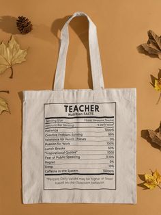 a tote bag with the teacher's list on it next to autumn leaves