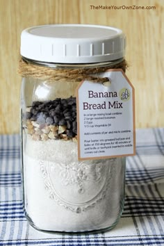 a jar filled with banana bread mix sitting on top of a table