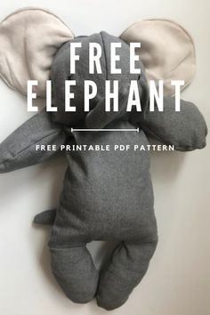 an elephant stuffed animal with the words free elephant on it's face and ears