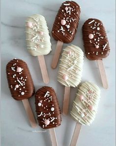 chocolate covered marshmallows on sticks with sprinkles