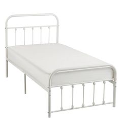 a white metal bed frame with no mattress