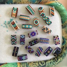 several beaded pieces are arranged on a tray