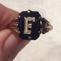 Stunning Art Deco 1920's black onyx and 9ct gold initial F  ring. Here we have an Art Deco ring with a lightly engraved gold initial F set onto black onyx. The initial F has simple gold shoulders in an openwork pattern in keeping with the clean lines of the Deco ring. The ring is in a good antique condition. The black onyx has a minor nick on the edge of  the onyx - to the left of the initial F and the usual rubs and minor scratches associated with normal use. The antique ring is marked 9c  inside the shank for 9ct gold. The onyx is firmly held in place with a claw  gold setting. The gold band is good and strong. A great statement or stand alone ring, and a lovely addition to your jewellery collection. Measures: Ring size: UK. N. 1/2.     US. just over 6 3/4                    Ring face: Classic Black Engraved Ring With Black Enamel, Victorian 14k Gold Signet Ring With Initials, Antique Initial Ring In 14k Gold, 14k Gold Engraved Ring With Initials For Collectors, Victorian Rings With Initials For Formal Occasions, Elegant Black Rings With Initials, Black 14k Gold Engraved Ring For Anniversary, Victorian 14k Gold Rings With Initials, Classic Black 14k Gold Engraved Ring