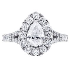 Certified 18 karat white gold diamond engagement ring features natural 1.15 carat pear cut diamond in the center and accented by 0.82 cts round cut diamonds on the side and set in custom made halo mounting. • Style- Halo Ring • Center Stone Shape-Pear • Center Carat Weight -1.15 • Total Carat Weight -1.97 • Certification-AGI • Color and Clarity Scale -I/I2 • Metal Type -18 karat white gold White Marquise Cut Gia Certified Diamond Ring, Gia Certified Pear-shaped Diamond Promise Ring, Gia Certified Pear Diamond Ring, Gia Certified Teardrop Diamond Ring For Formal Occasions, Gia Certified Pear-shaped Diamond Ring, Formal Gia Certified Teardrop Diamond Ring, Pear-shaped Cubic Zirconia Wedding Jewelry In Diamond White, Gia Certified Teardrop White Ring, Pear-shaped Moissanite Diamond Ring