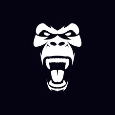 an angry gorilla face with its mouth open and eyes wide open, on a black background