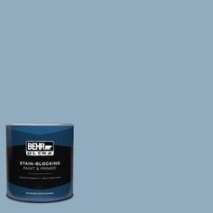 a can of behr ultra stain - blocking paint on a blue background