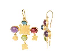 With a playful, earthy sophistication, Judy Geib has created a pair of stunning earrings combining her love of colorful gems with her creative magic. A 18K yellow gold folklorish shape centers these earrings with tourmaline, peridot, amethyst and aquamarine around it. The intentionally asymmetrical composition dangles from the 18K yellow gold ear wires.total length : 1 3/4"width : 1 1/8"multi gems : 4mm x 6mm to 7mm x 9mm18K yellow gold ear wires Fusion Style Multi-stone Yellow Gold Earrings, Yellow Gold Multi-stone Fusion Earrings, Shape Centers, Asymmetrical Composition, Judy Geib, Alice Cicolini, Zoe Chicco, Stunning Earrings, Ear Wires