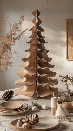 a wooden christmas tree sitting on top of a table next to plates and bowls filled with food