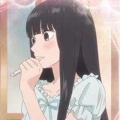 a girl with long black hair brushing her teeth