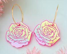 These light-weight rose earrings are the perfect statement earrings to add an extra pop to your outfit! Acrylic is very lightweight so you can enjoy large, statement earrings comfortably all day. ♡ Made with holographic acrylic with pink engraved details ♡ Size: Approximately 2.25 inches in length measured from top of earring hoop ♡ Earring hoop is made from 18k gold plated brass ♡ Care Instructions: ♡ - To clean: Wipe with a microfiber cloth to remove any dust - Avoid contact with perfumes and Retro Earrings, Earring Hoop, Retro Earring, Bold Earrings, Fun Jewelry, Earrings Flower, Acrylic Jewellery, Custom Earrings, Jewelry Stand