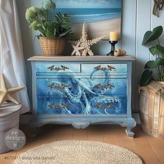 a blue dresser with an octopus painted on it