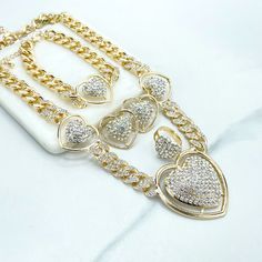 18k Gold Filled Iced Curb Link Chain with CZ Heart Charms Set, Necklace, Bracelet, Earrings & Ring, Wholesale Jewelry Making Supplies.Set Size:Necklace: -Length: 19 inches + 3.3 inches extender | Width: 13mm | Big heart: 47mm x 45mm | Medium Hearts: 26mm x 23mmBracelet:-Length: 8 inches + 3.2 extender | Width: 13mm | Heart: 26mm Earrings: 27mmRing :-Thickness: 4mm | Hand Width: Adjustable | Hand Thickness: 17mm