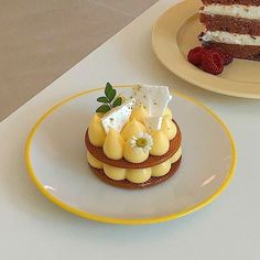 two plates with desserts on them sitting on a table