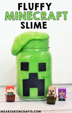 a jar filled with green slime next to small toy figurines and the words fluffy minecraft slime