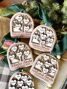 three personalized christmas ornaments on top of an open book