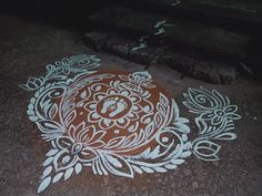 an intricately painted design on the ground