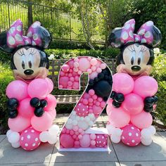 mickey and minnie mouse balloons in the shape of numbers