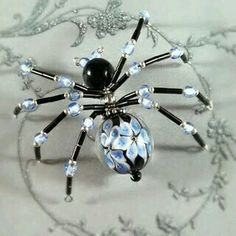 a spider brooch sitting on top of a table