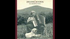 an old photo of a man playing the accordion with his dog