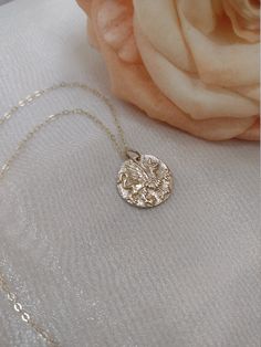 Similar items: ALLDANAE.etsy.com Please read my shop policies before ordering: https://www.etsy.com/shop/AllDanae#policies This necklace features a replica of an ancient Greek coin with the image of a griffin. The griffin has the body of a lion, and the head, wings, and talons of an eagle. The lion is the king of beasts, and the eagle the king of birds. The griffin combines the strengths of both, creating a powerful symbol of courage, leadership, and divine protection. The pendant measures appro Bronze Necklace Gift In Vintage Style, Bronze Antique Style Necklace Gift, Ancient Style Round Pendant Necklace For Gift, Goddess Style Coin Pendant Jewelry For Gift, Bronze Vintage Necklace Gift, Mythological Round Pendant Necklace For Gifts, Goddess Style Silver Medallion Necklaces, Goddess Style Silver Medallion Necklace, Gold Engraved Mythological Necklace