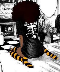 a woman sitting on top of a bed in a room with black and yellow striped socks