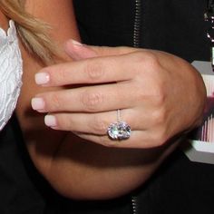 a close up of a person wearing a ring