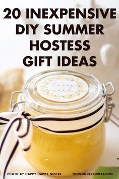 a jar filled with yellow liquid sitting on top of a table