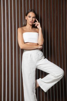 Full-length white 100% linen pants in white. High waist, drawstring waistband, wide legs with side-seam pockets. Regular fit   XS/S Waistband 65-75 cm/ 25,5-29,5 inches  Inside leg length 84cm/ 33 inches M/L  Waistband 75-85 cm/ 29,5-33,5 inches Inside leg length 76cm/33.5 inches Model's height: 173cm, 5' 8" wearing size XS/S Order preparing time: 1-3 working days Free worldwide delivery for all purchases  Delivery time: Europe: 2-5 working days USA: 2-4 working days Rest of the world: 2-5 worki Casual White Linen Wide Leg Pants, White Linen Wide Leg Casual Pants, High Waist Linen Wide Leg Loungewear Pants, White Linen Wide Leg Vacation Pants, White Linen Wide Leg Pants With Elastic Waistband, White Linen Wide Leg Pants For Vacation, White Linen Pants For The Beach, White Linen Pants For Spring, White Linen Pants For Beach