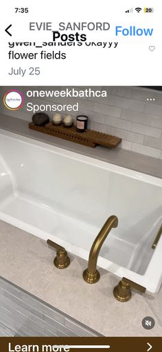 a white bath tub sitting on top of a bathroom counter