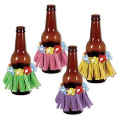 three brown beer bottles decorated with multicolored tassels and bows on them