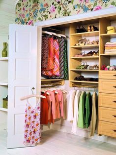 an organized closet with clothes and shoes