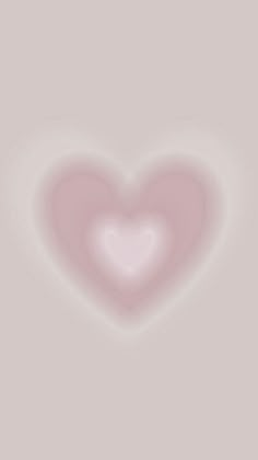 a pink heart on a gray background with some blurry lines in the bottom right corner