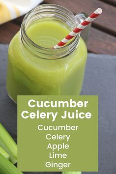 cucumber celery juice in a mason jar with two red and white striped straws