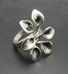 Sterling silver ring 925/1000, flower. Stamped 925.Approximate weight 11.6 grams. Top width 3.3 cm (1.24 inches). All our jewels are made from solid sterling silver 925/1000 and are carefully crafted by hand in our family workshop. We dispatch your orders in 5 working days, worldwide and the postage is $5. We ship registered priority mail. Please allow 5-7 working days for delivery in Europe and 10-15 working days outside Europe. For any questions - please do not hesitate to contact me! Silver Handmade Flower Ring For Formal Occasions, Handmade Silver Flower Ring For Formal Occasions, Silver Flower Shaped Ring Stamped 925, Unique Sterling Silver Flower Ring, Silver Flower Shaped Hallmarked Rings, Unique Silver Flower-shaped Jewelry, Unique Silver Flower Shaped Ring, Sterling Silver Flower Ring With Polished Finish, Silver Sterling Silver Flower Ring With Polished Finish