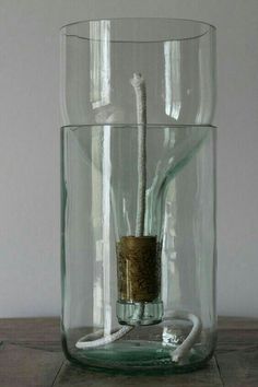 a glass vase with a rope in it