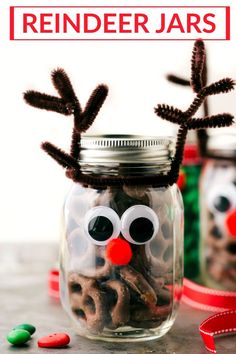 reindeer jars are filled with candy and pretzels to make them look like they're ready for the holiday season