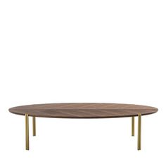 an oval wooden table with gold legs