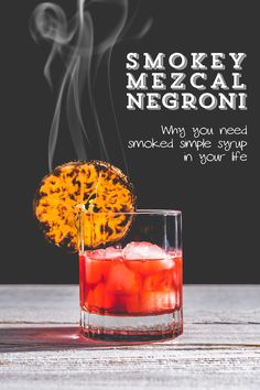 smokey mezcal negroi cocktail with orange garnish