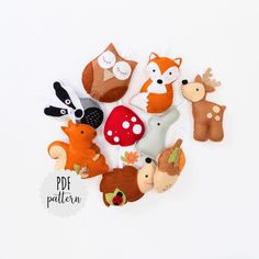 a group of felt animals sitting next to each other on a white surface with the words pdf pattern below it