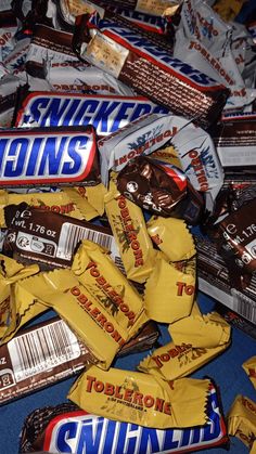 a pile of candy bars sitting on top of a table