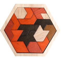 an orange and black geometric design is shown on a white background with the pattern made out of wood