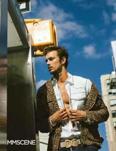 a man standing next to a traffic light