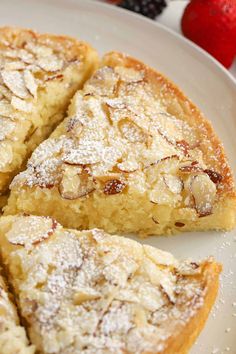 several pieces of pie on a plate with strawberries in the backgroung